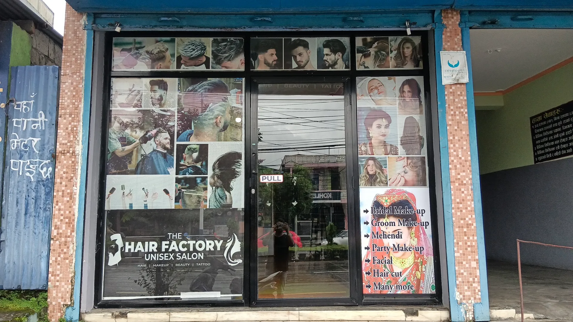 Storefront at Zero KM Lakeside, signage still showing the previous name ‘The Hair Factory Unisex Salon’